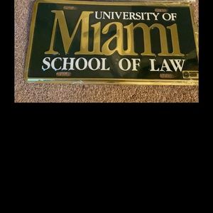 U of Miami license plate and vintage button.